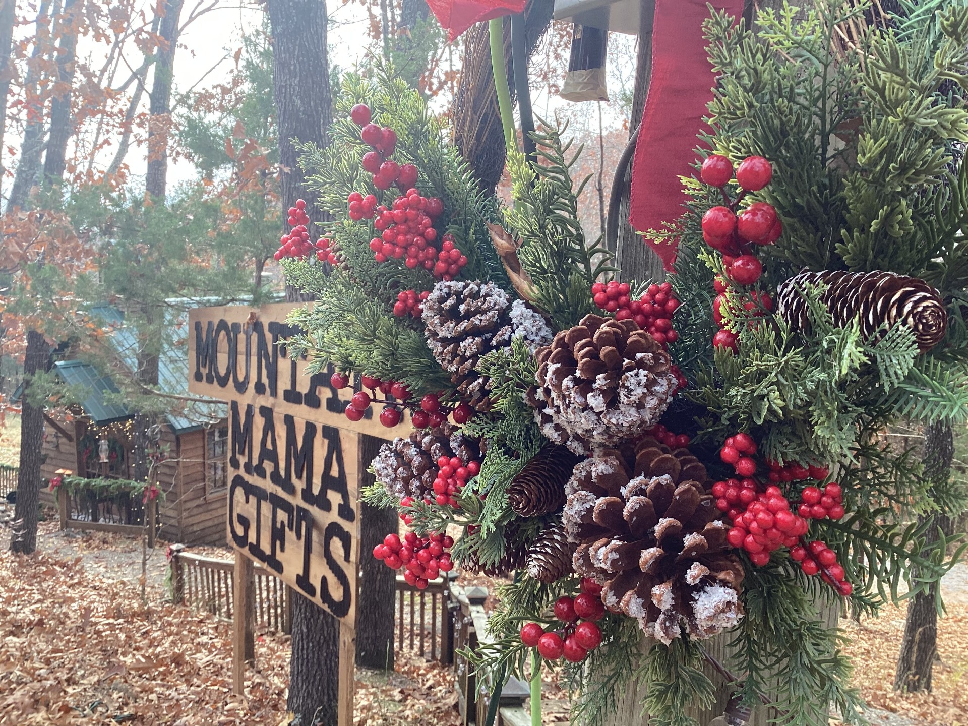 Bear Creek Cabin Resort entrance with holiday wreath and wooded cabins