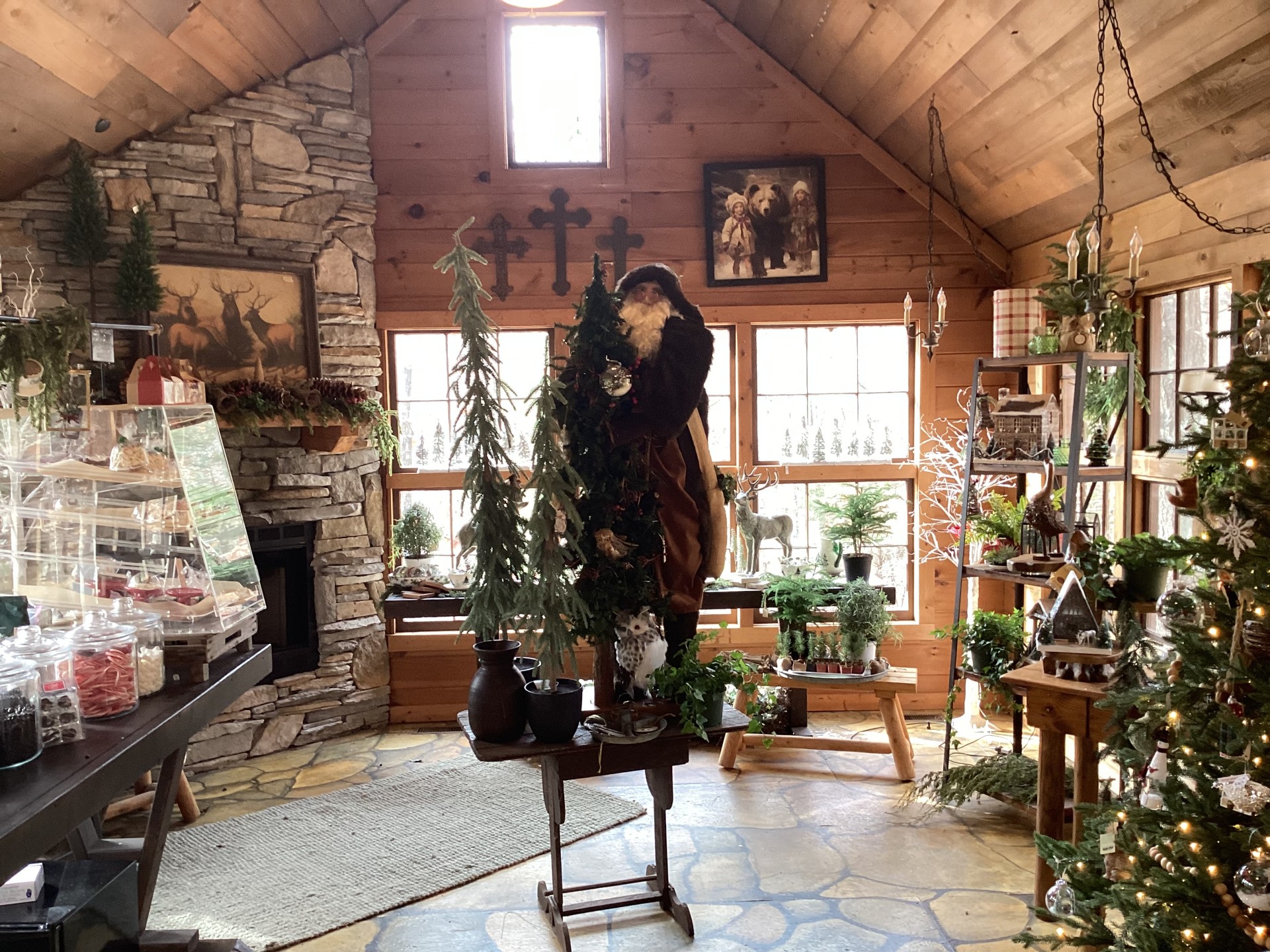 Bear Creek Cabin Resort rustic welcome area with stone fireplace and holiday decor